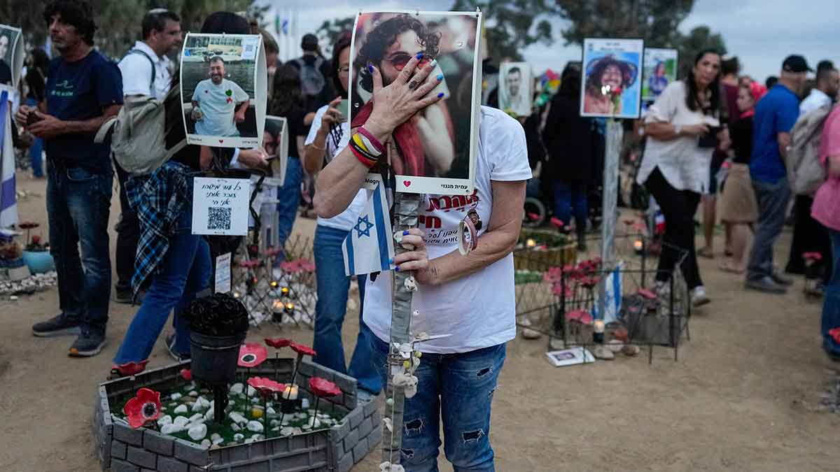 Endless agony: Visitors at the site of the Nova music festival near Kibbutz Reim, southern Israel, where hundreds were killed and abducted by Hamas | AP