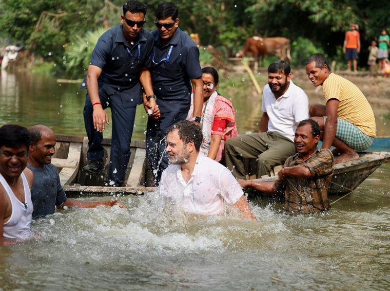 Deep impact: Rahul Gandhi during an interaction with fishermen in Begusarai, Bihar, on November 2. Also seen are Vikassheel Insaan Party chief Mukesh Sahni (extreme left) and Congress leader Kanhaiya Kumar (on the boat, wearing white T-shirt) | PTI