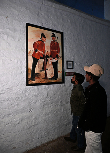 Looking back: Visitors view a painting featuring Irish soldiers at the Dagshai Jail Museum | Sanjay Ahlawat
