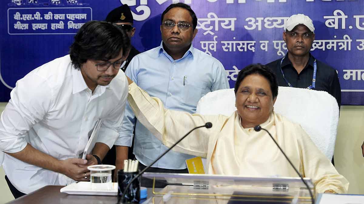 Happier times: Mayawati with her brother Anand Kumar (middle) and nephew Akash Anand | PTI