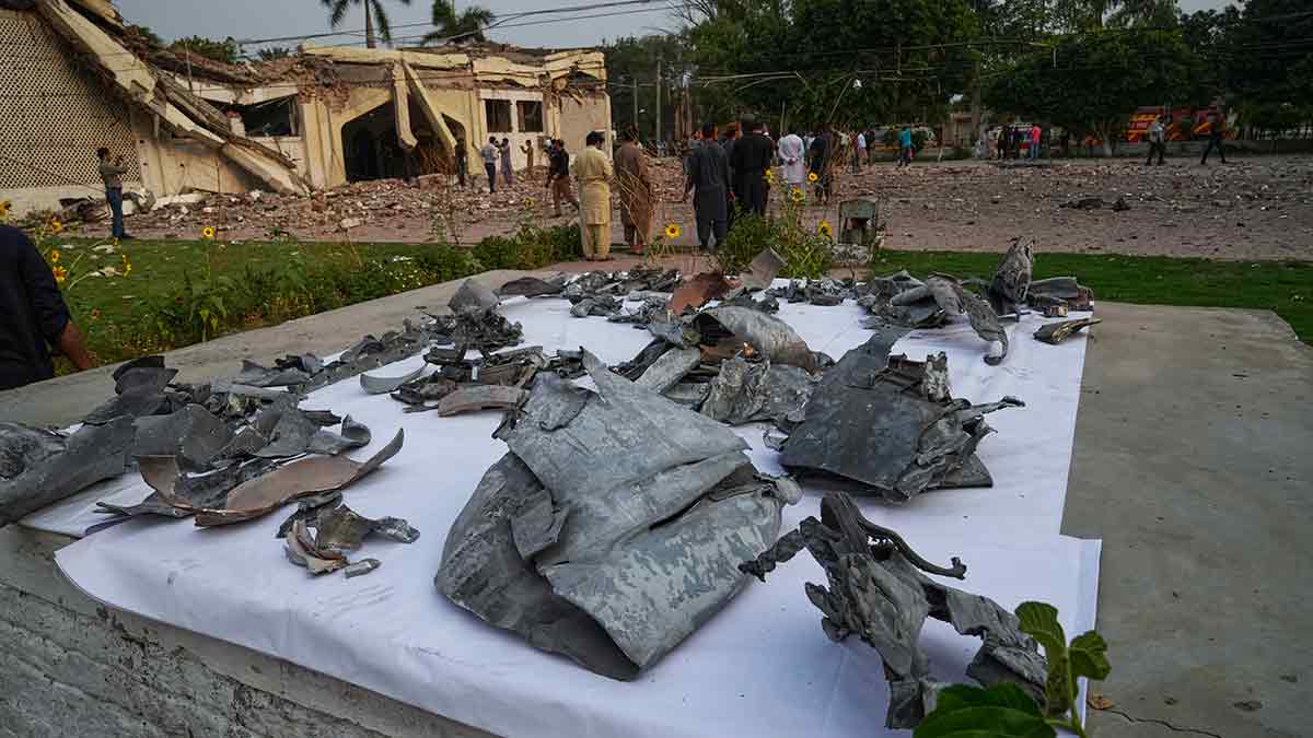 Stern reaction: Metal pieces of suspected Indian missiles lie on the compound of a mosque damaged by Indian missile attack in Muridke in Pakistan’s Punjab province on May 7 | AP