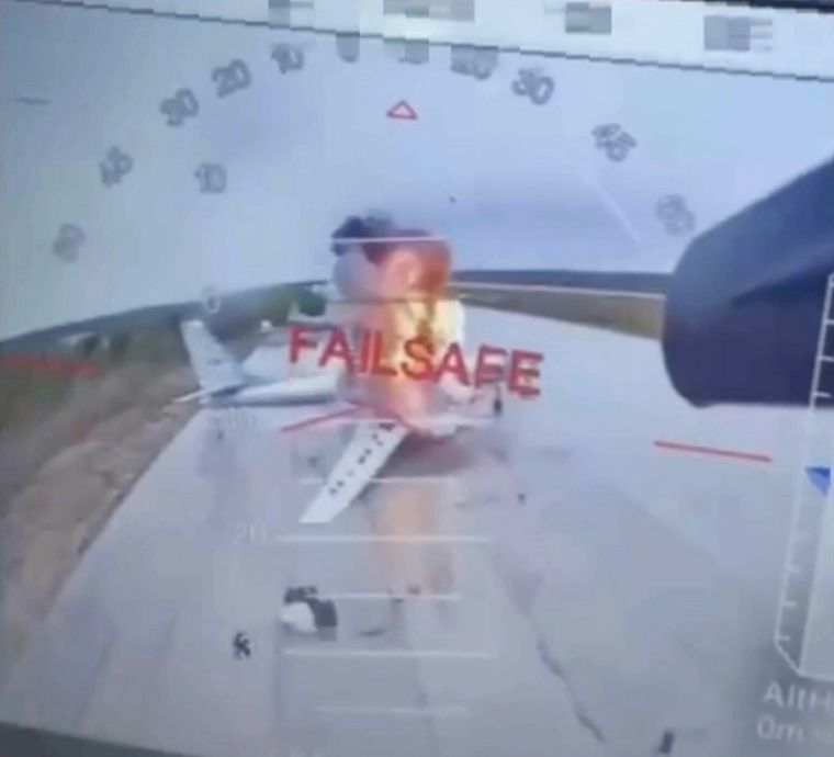 A video grab of a Ukrainian drone striking Russian planes | AP