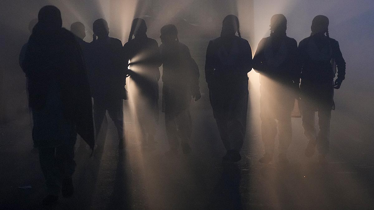 A bleak picture: Schoolgirls walk through a dense fog on a winter morning in Delhi | PTI