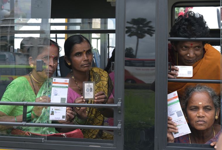 Riding high: A file photo of women beneficiaries of Karnataka’s free bus travel scheme posing in front of the Vidhan Soudha on the day of the scheme launch | Bhanu Prakash Chandra