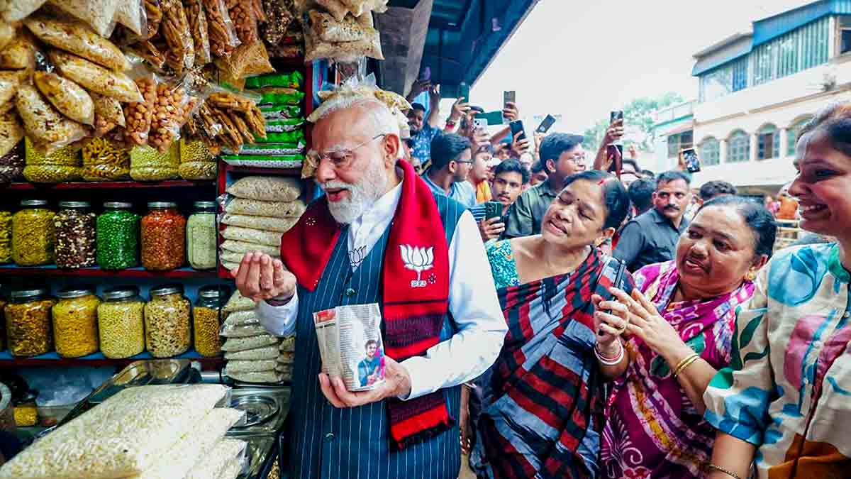 Taste of the east: Prime Minister Modi on the sidelines of a public meeting in West Bengal on April 19 | PTI