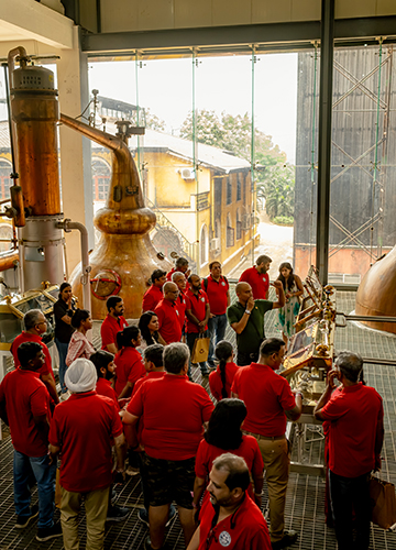 In high spirits: Whisky enthusiasts at Paul John’s Goa distillery during the launch of EGO, a limited-edition single cask whisky, in August.