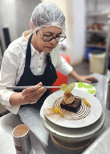 Plate full of care: Valerie in the Howling Wolves kitchen in Goa.