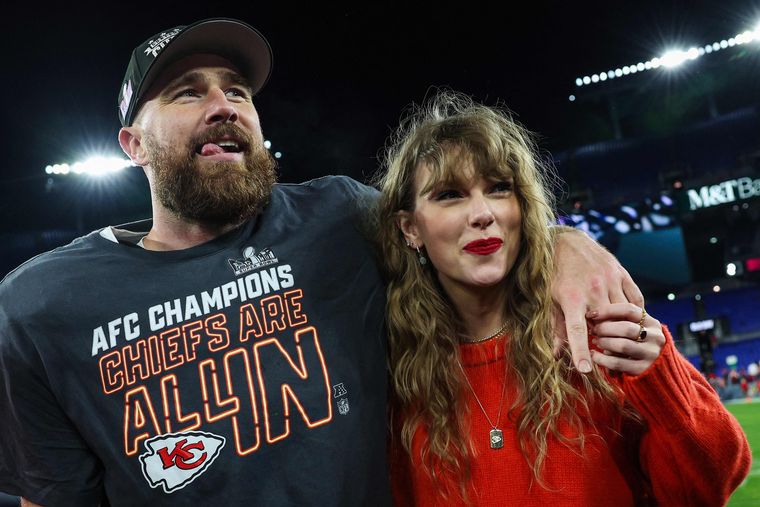 Swift with fiance Travis Kelce after a football match in Baltimore | AFP