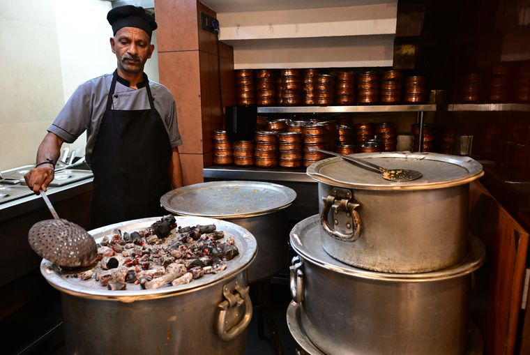 Once the biryani is transported from the central kitchen to Azad restaurants, glowing embers are placed on top before opening the dum | Sreelakshmi Menon