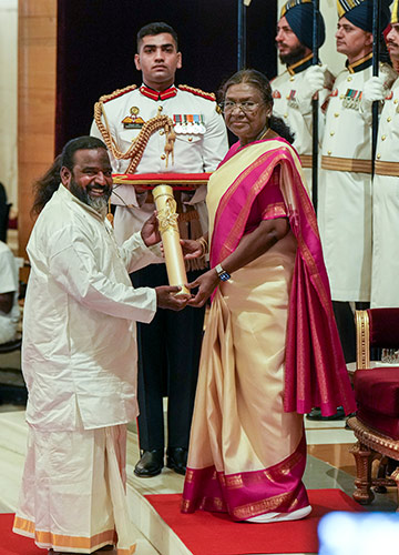 On cloud nine: President Droupadi Murmu confers the Padma Shri on Velu Aasan | PTI