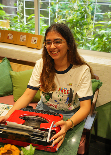 Red-hot verse: Poet Surbhi Dhoot attends small gatherings in Mumbai with her red Brother Deluxe 220, typing out poems for strangers on the spot | Courtesy Surbhi