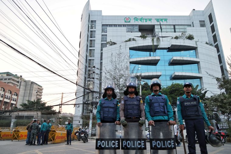 Guarding democracy: Police outside the Bangladesh Election Commission office ahead of the general election announcement.