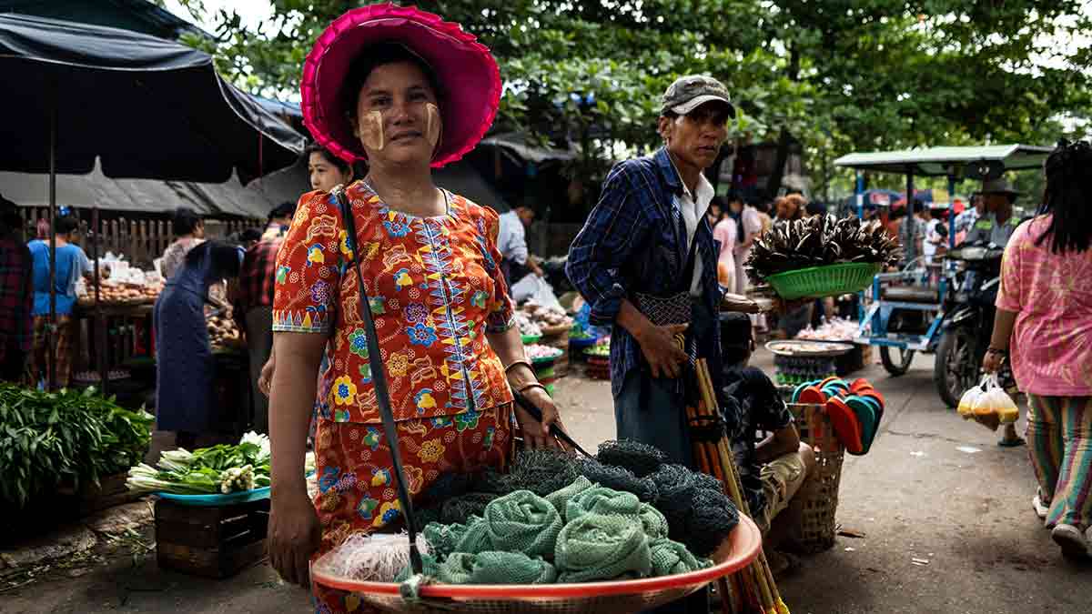 Uncertain future: Vendors at a street market in Yangon. Public sentiment in Myanmar is overwhelmingly against the military | Getty Images