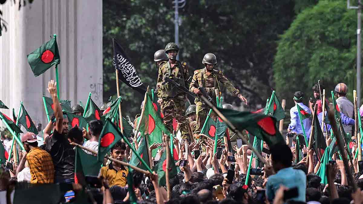 Calm amid the storm: Soldiers deployed near Dhaka University on August 5, 2024, as anti-government protesters march towards the prime minister’s residence | AFP