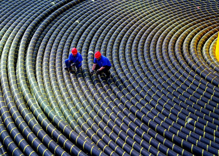 High-wire act: Workers at a submarine cable manufacturing facility in China’s Shandong province | Getty Images