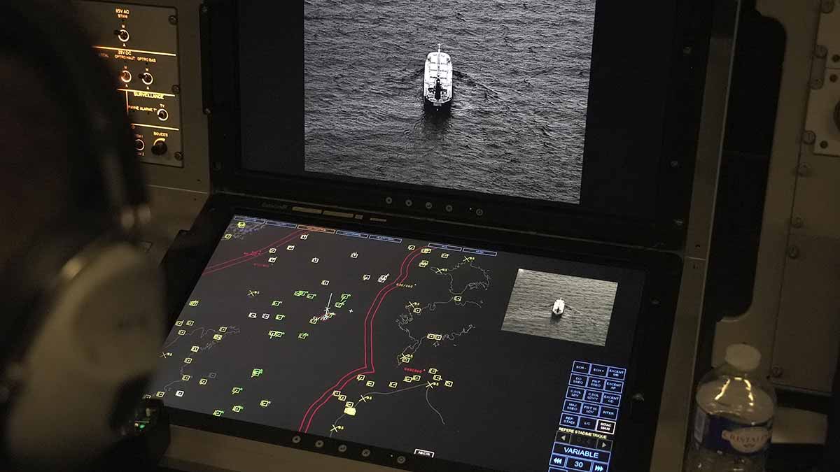 Close watch: Crew members aboard a French surveillance plane patrolling the Baltic Sea as part of a mission to protect undersea cables and pipelines | AP