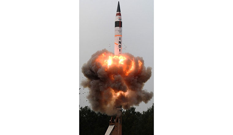 Aiming high: Agni V blasts off from a canister mounted atop a mobile truck on Wheeler island, off the Odisha coast | AFP