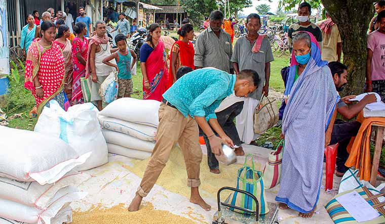 Better help: Beneficiaries of the PM Garib Kalyan Anna Yojana in West Bengal. India needs to re-target its existing subsidies, argue the authors.