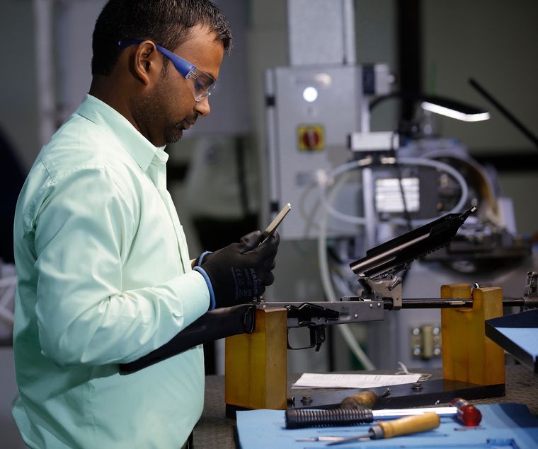 An employee gives a demonstration of the rifle | Pawan Kumar