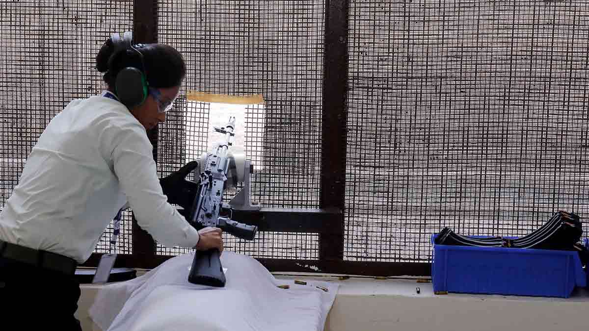 An employee gives a demonstration of the rifle