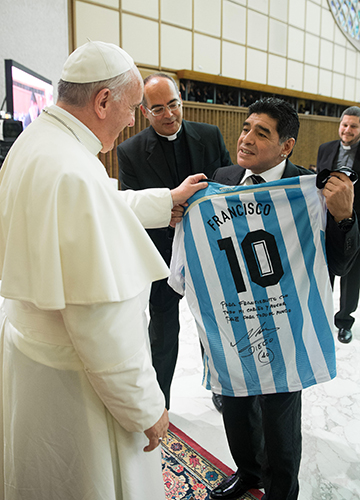 Francis with football legend Diego Maradona at a special papal audience for players and organisers of a charity match in Rome in September 2014 | Getty Images