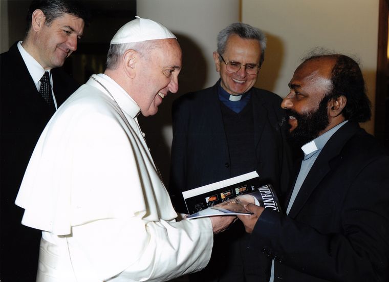 In Mumbai (right) Fr William Nellikal meeting with Pope Francis.