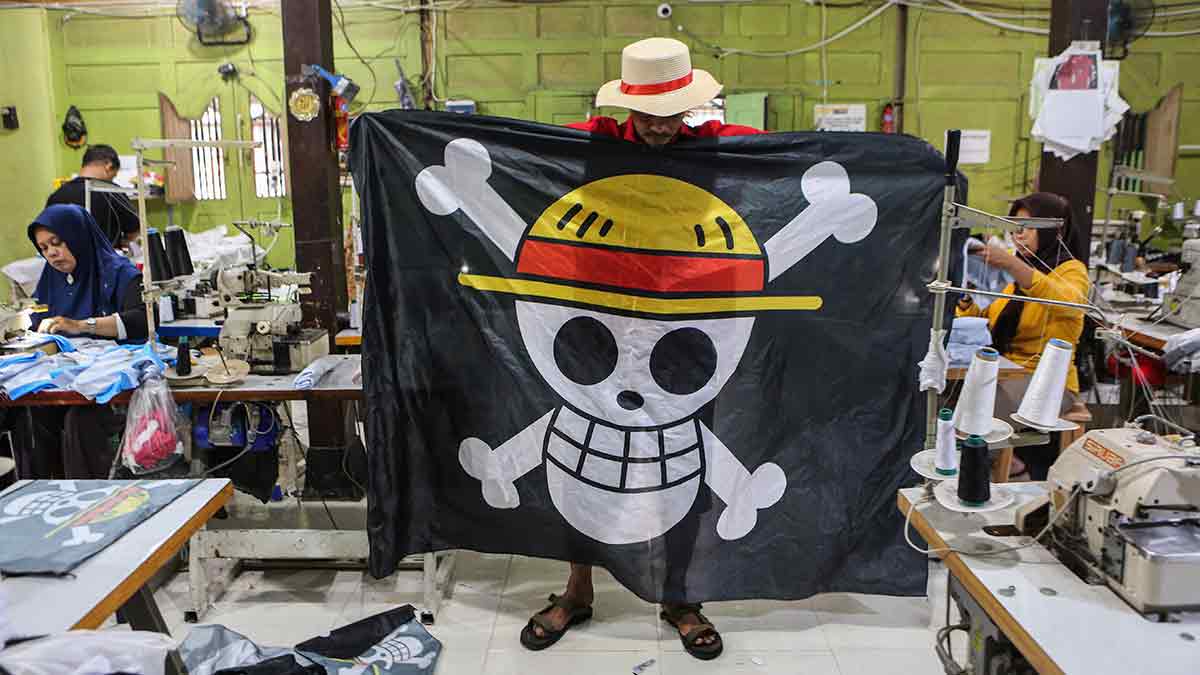 Banner of revolt: A worker at an apparel factory in Karanganyar, Indonesia, showing a Jolly Roger flag on August 13, 2025. The Gen Z movement in Indonesia last year had protesters raising the pirate flag on public flagpoles alongside the national flag | Getty Images