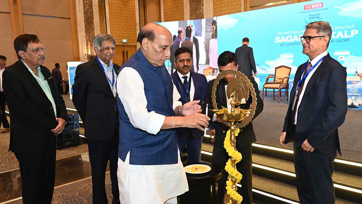 Auspicious beginning: Defence Minister Rajnath Singh lighting the lamp to inaugurate the ‘Sagar Sankalp’ event organised by THE WEEK and GRSE in Kolkata. (From left) Arun Sharma, executive chairman, IRClass; Baba Kalyani, chairman and managing director of Bharat Forge; Commodore P.R. Hari (retd), chairman and managing director of GRSE; and Riyad Mathew, chief associate editor & director, THE WEEK | Salil Bera
