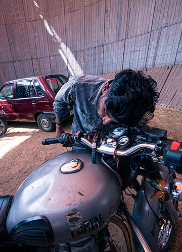 Drive to thrive: A rider checking his bike