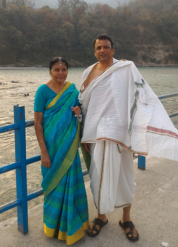 With wife Malathi on the banks of the Ganga.