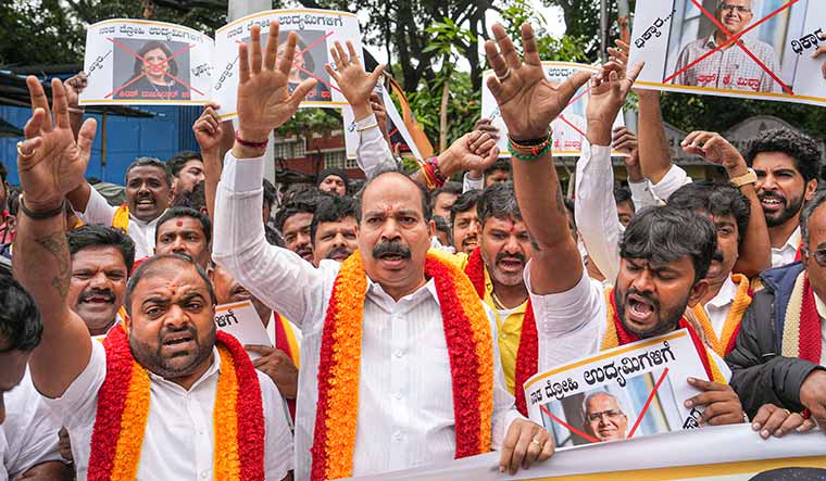 No compromise: Members of the Karnataka Rakshana Vedike protest in Bengaluru against industry leaders for opposing the job reservation bill | PTI