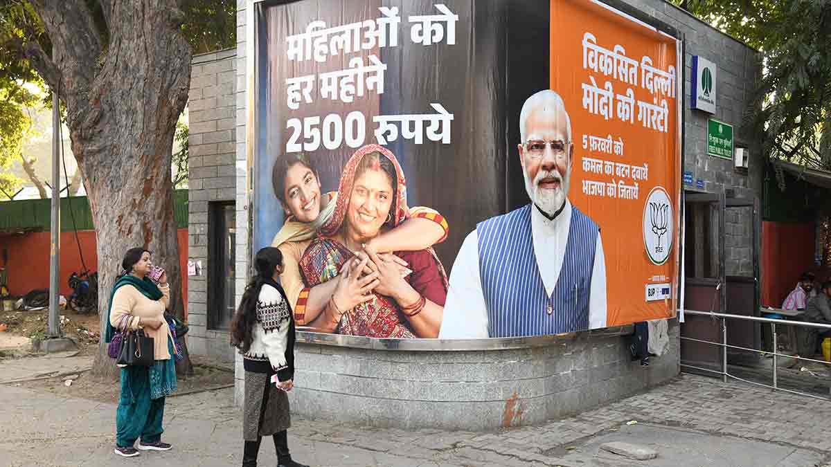 36-Women-look-at-a-BJP-election-hoarding-in-Delhi
