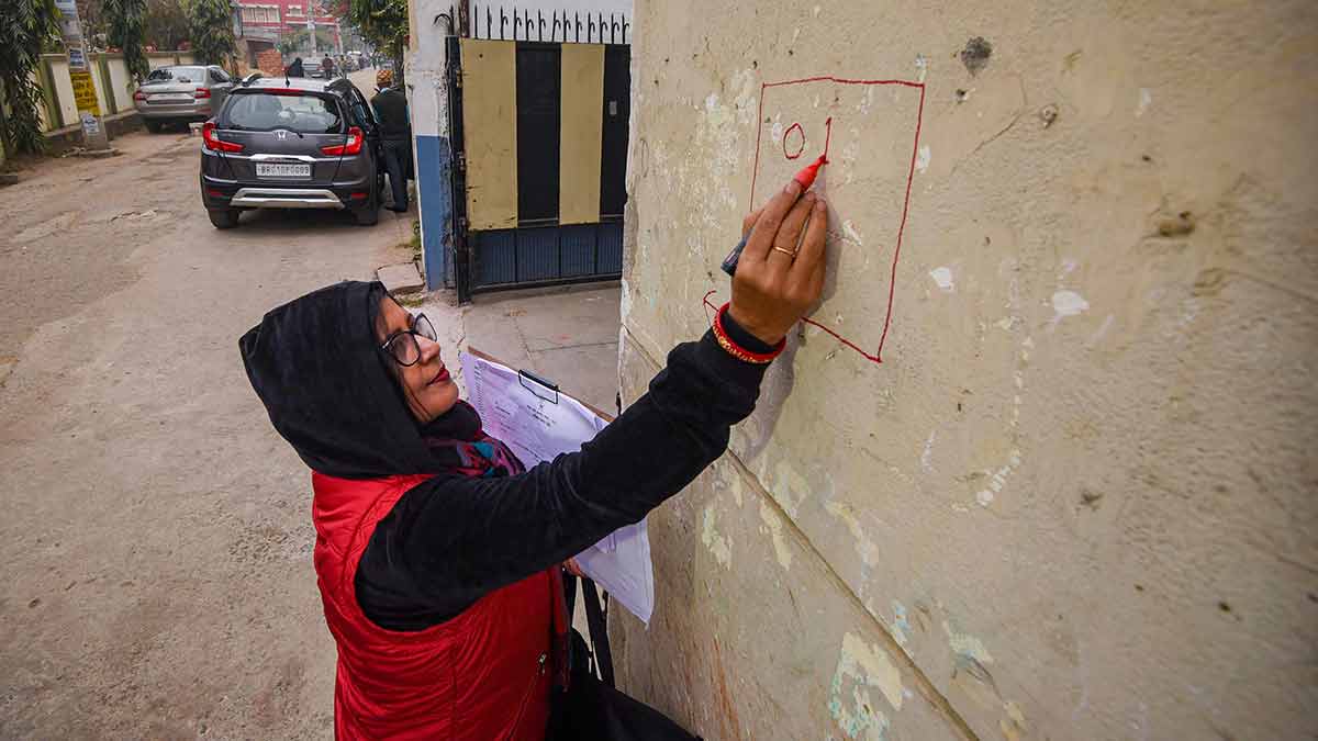 Making it count: An enumerator marks a house in Patna during the state caste census | PTI