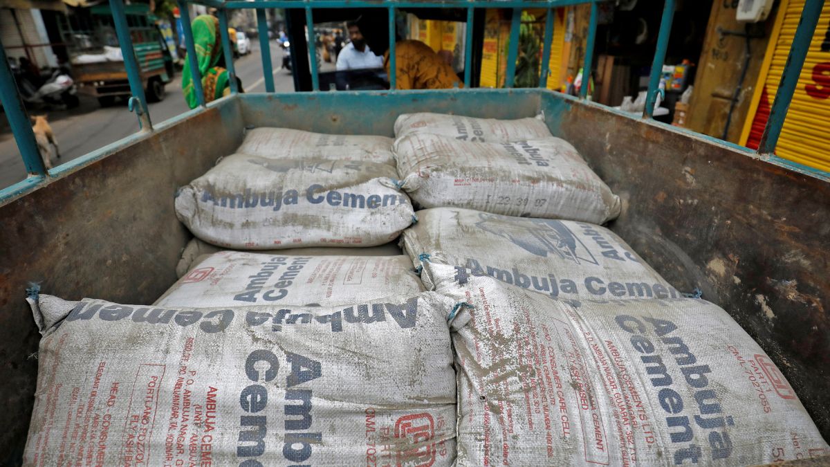 A view shows Ambuja Cement bags, to be carried to a construction site, in a load carrier in Ahmedabad, India, July 29, 2022 | Reuters