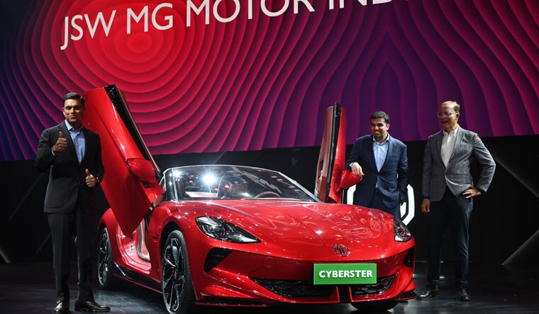 Rajeev Chaba, CEO Emeritus of MG Motor India; Sajjan Jindal, Managing director of JSW Steel and Parth Jindal, Managing Director, JSW Cement and Paints pose with MG Cyberset during a Mumbai event | Amey Mansabdar