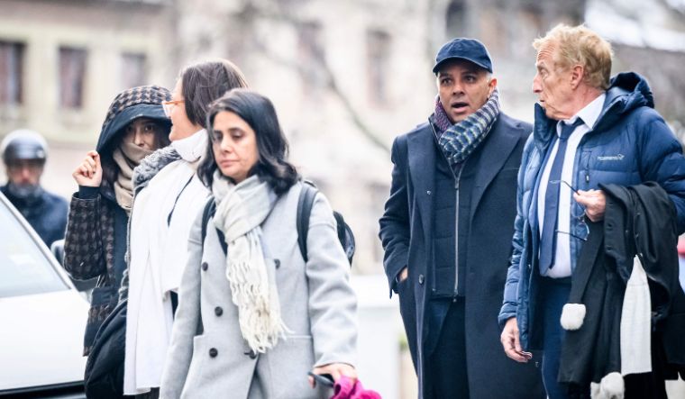 Indian-Swiss billionaire family members Namrata Hinduja (L) and Ajay Hinduja (2ndR) arrive at the Genevas courthouse with their lawyers Yael Hayat (C) and Robert Assael (R) | AFP