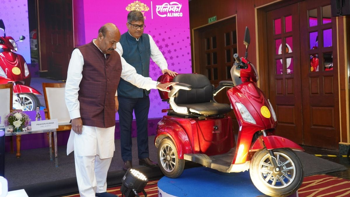 Union Minister for Social Justice & Empowerment Virendra Kumar (left) with Alimco’s new EV scooter for the differently-abled.