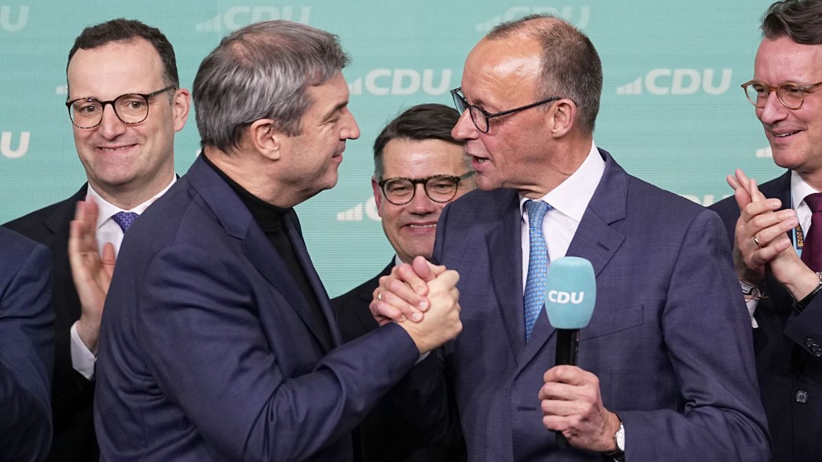 CDU leader Friedrich Merz shakes hands with Markus Soeder (left), leader of CSU and Minister-President of Bavaria, at Berlin after the German national election | AP