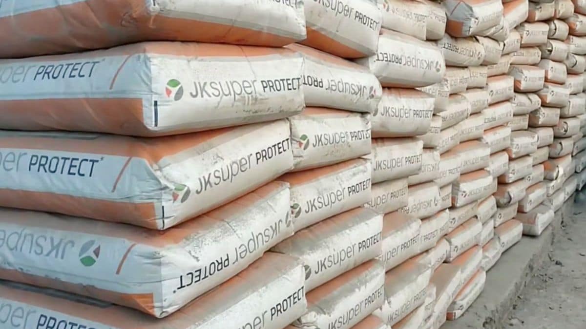 Stacks of JK Cement near a warehouse | YouTube
