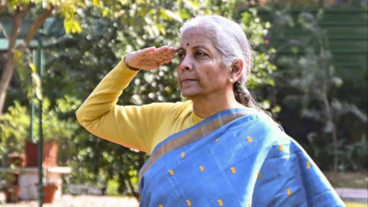 Union Finance Minister Nirmala Sitharaman takes salute while unfurling the tricolour during 77th Republic Day celebrations on Jan 26 | X