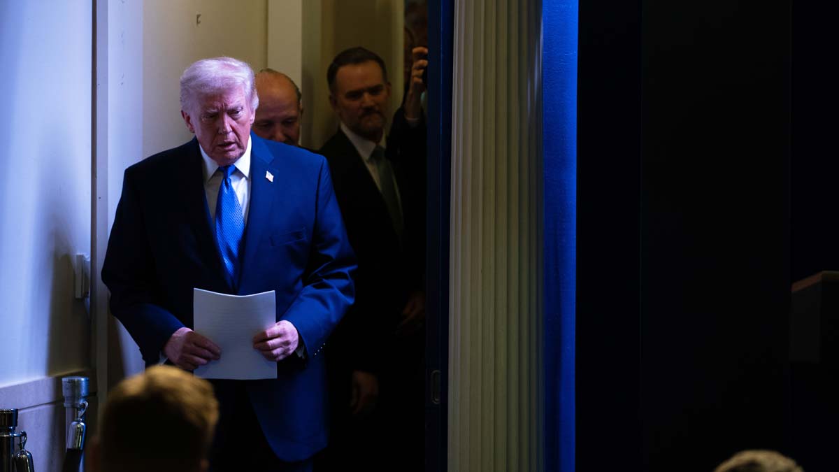President Donald Trump arrives to a press briefing at the White House on Friday | AP