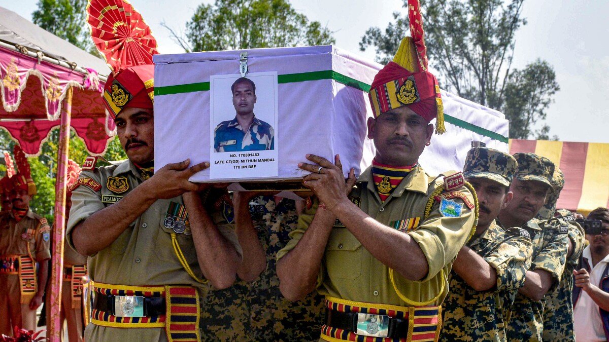 personnel carry the mortal remains of Constable Mithun Mandal to be sent to his family in West Bengal, after a wreath-laying ceremony at the airport, in Imphal, Manipur | PTI
