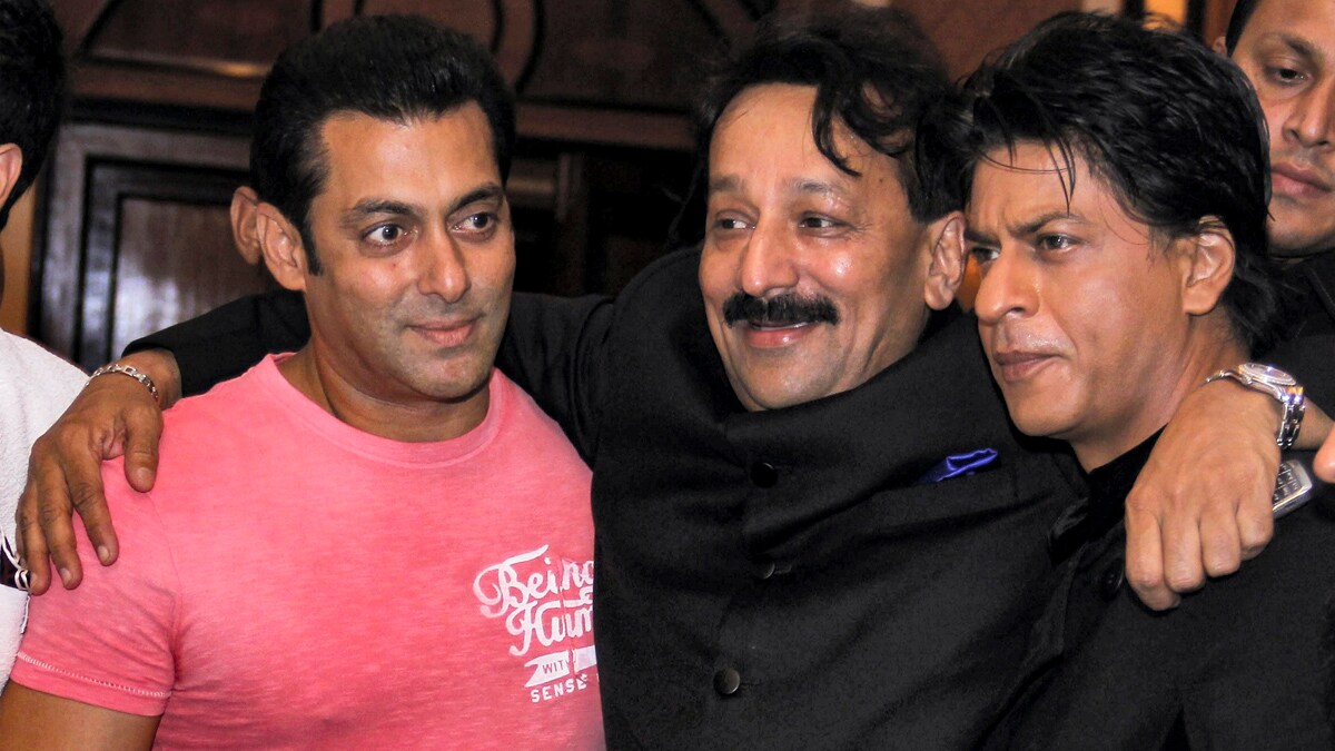 Baba Siddique with actors Salman Khan and Shah Rukh Khan during an Iftar party in Mumbai on July 21, 2013 | PTI