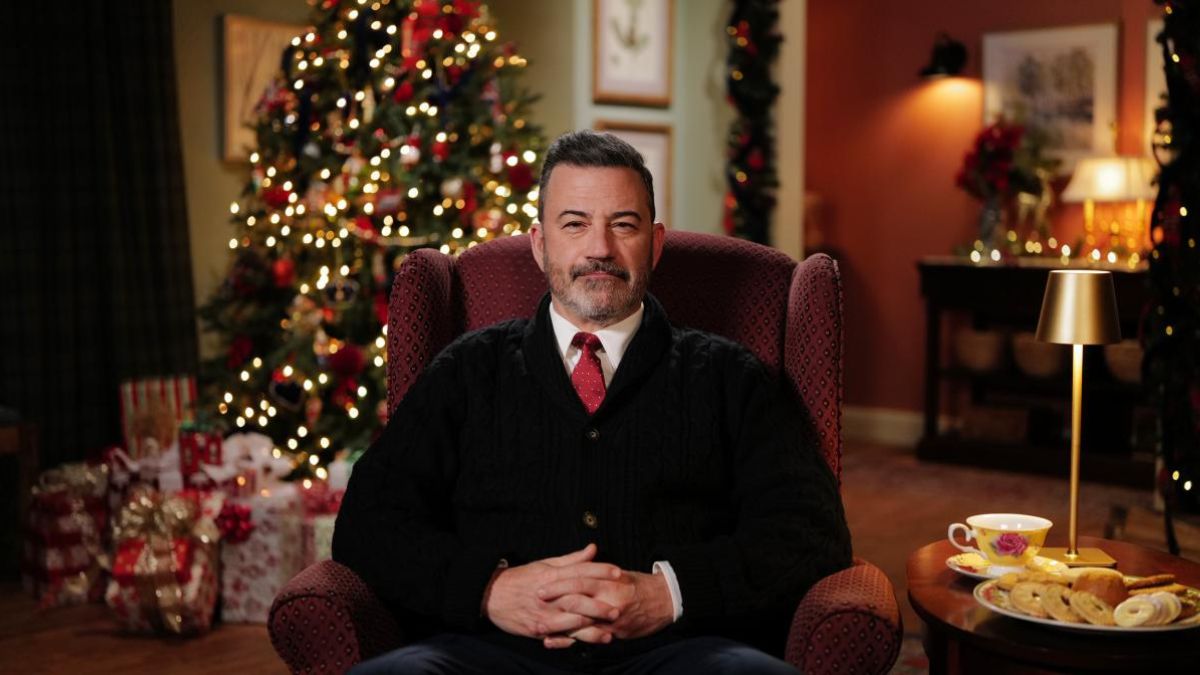 Jimmy Kimmel addressing viewers in a vibrant Christmas setting | Channel 4