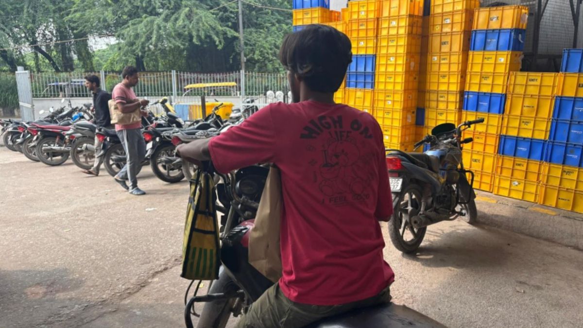 A delivery partner hurries to deliver the morning order | Sakshi Srivastava