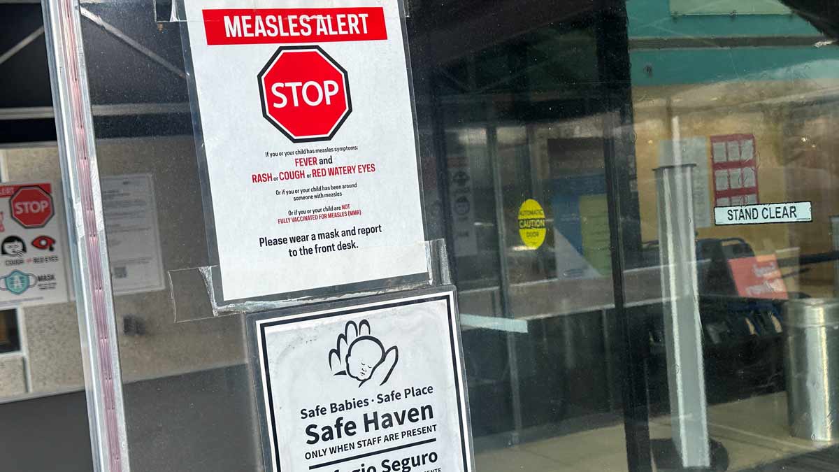A measles alert sign hangs outside the entrance to the Cohen Children's Medical Center in New Hyde Park, New York, US | Reuters