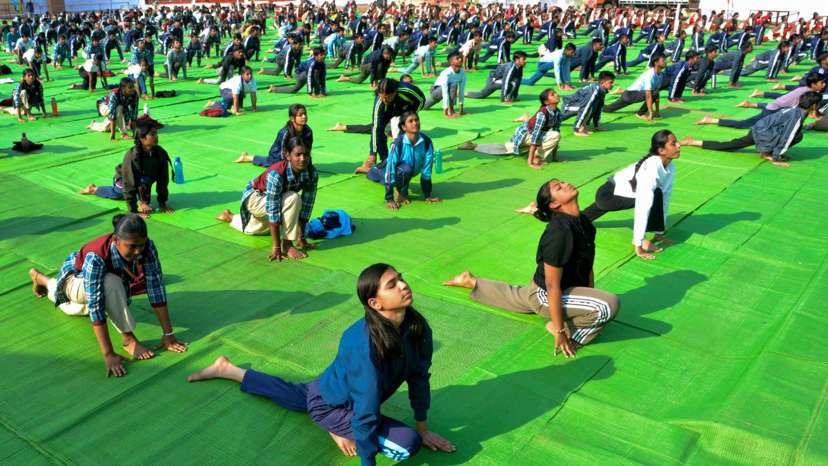 School students rehearse for a mass 'Surya Namaskar' event ahead of Swami Vivekananda's birth anniversary marking National Youth Day, at a school, in Bhopal | PTI