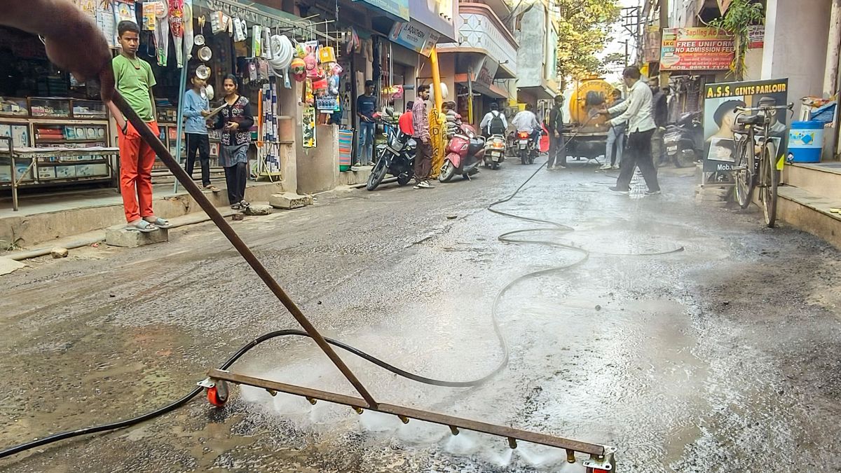 Indore Municipal Corporation workers conduct a cleanliness drive after several people were affected due to consumption of contaminated water at Bhagirathpura area, in Indore, Madhya Pradesh | PTI