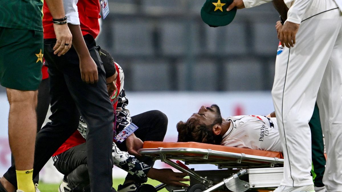Pakistan's Hasan Ali is assisted off the field on a stretcher after suffering an injury during the first day of the second Test cricket match between Bangladesh and Pakistan at the Sylhet International Cricket Stadium in Sylhet | AFP
