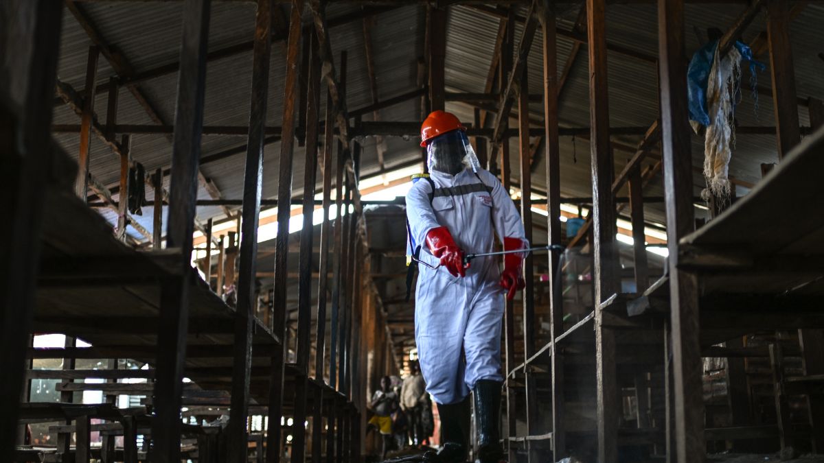 A sanitation worker from the Bunia city government sprays chlorine to disinfect the central market, as Ituri province continues to combat an Ebola outbreak, in Bunia, Congo | AP